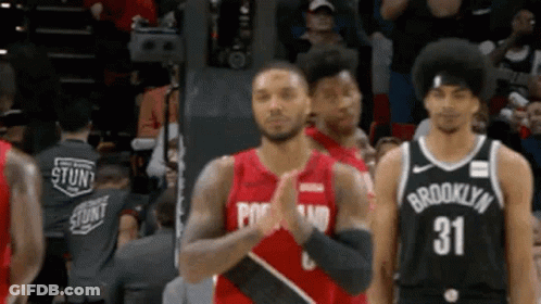 Basketball Players Standing On Court GIF