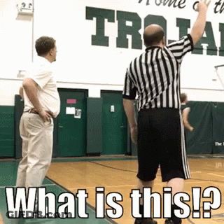 Basketball Referee In Front Of Sign Saying What Is This GIF