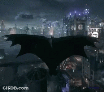 Bat Flying Over City Night Getham Hotel Sign GIF