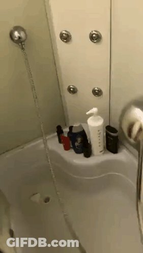 Bathroom Shower And Bathtub Filled With Bottles GIF