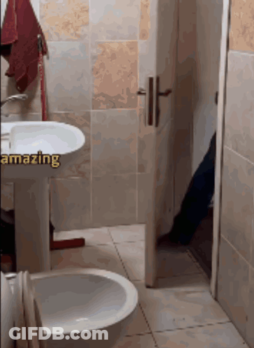 Bathroom With Sink And Toilet Saying Amazing GIF