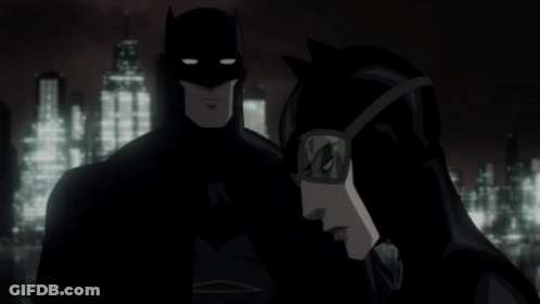 Batman And Catwoman Are Standing Next To Each Other In Front Of A City Skyline GIF