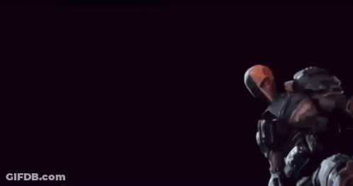 Batman And Deathstroke Are Standing Next To Each Other Holding Guns GIF