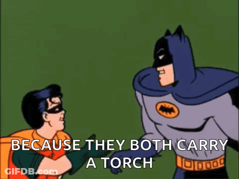Batman And Robin Are Standing Next To Each Other And Batman Says " Because They Both Carry A Torch " GIF