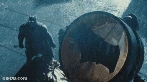 Batman And Robin Fighting In Rain GIF