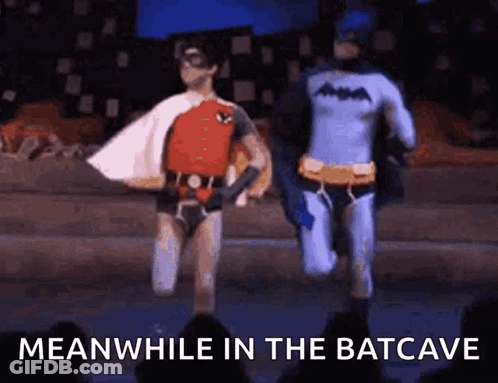 Batman And Robin Running On Stage Meanwhile In The Batcave GIF