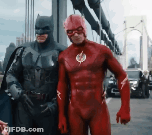 Batman And The Flash Are Posing For A Picture Together GIF