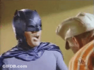 Batman Costume Man Next To Helmet Man GIF