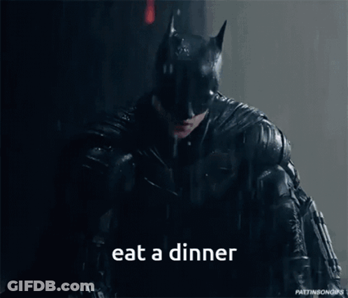 Batman Eating Dinner In The Rain GIF