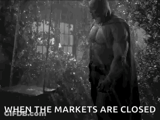 Batman Is Standing In Front Of A Window In A Black And White Photo . GIF