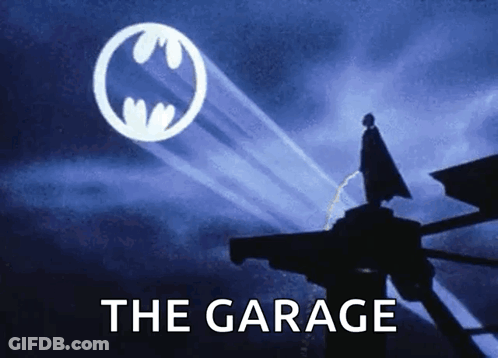 Batman Logo Poster Saying The Garage GIF