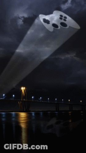Batman Logo Projected On Dark Background GIF