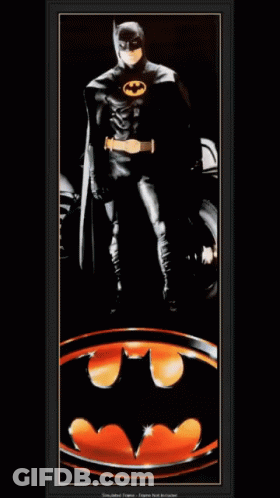 Batman Standing In Front Of Bat Symbol GIF