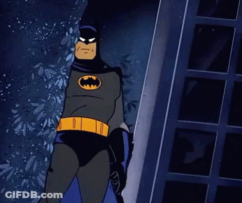 Batman Standing In Front Of Door Holding A Bat GIF