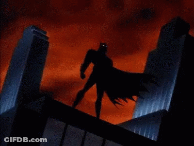 Batman Standing On Building With Lightning Bolt GIF