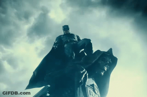 Batman Statue On Justice League Logo GIF