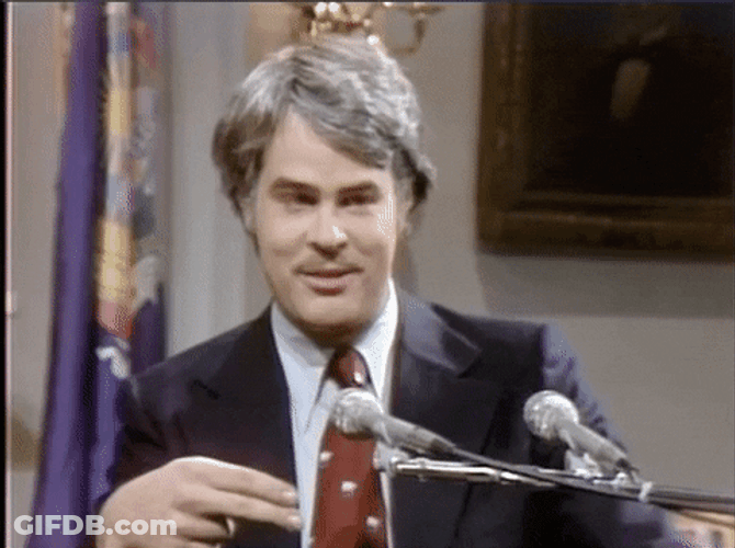 Batting Eyelashes Dan Aykroyd Smile GIF