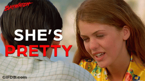 Baywatch Movie Poster With Man And Woman Hugging GIF