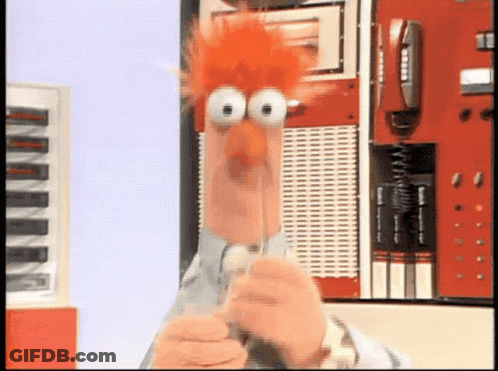 Beaker From The Muppet Show Is Holding A Pen GIF