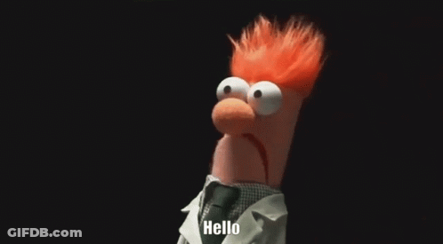 Beaker From The Muppets Is Wearing A Lab Coat And Tie And Saying Hello . GIF