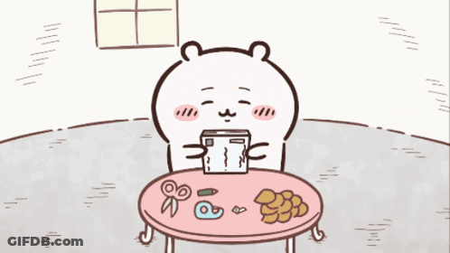 Bear Sitting At Table Holding Box GIF