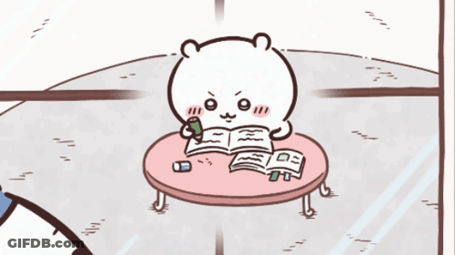 Bear Sitting At Table With Book GIF