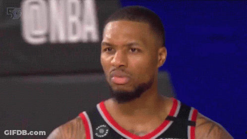 Bearded Basketball Player In Front Of NBA Sign GIF