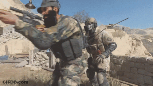 Bearded Gunman And Skull-Headed Rifleman GIF