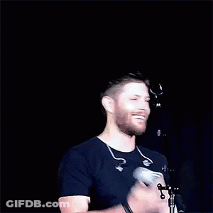 Bearded Man Applauding At Microphone GIF