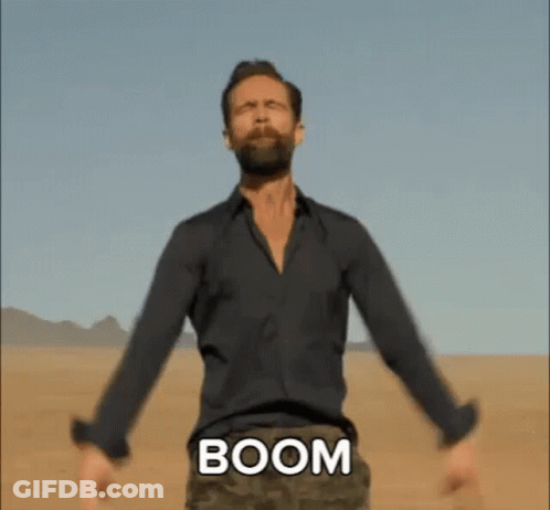 Bearded Man Arms Outstretched Desert With Boom On Chest GIF