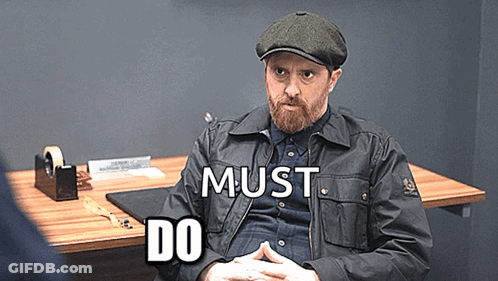 Bearded Man At Desk Saying Must Do GIF