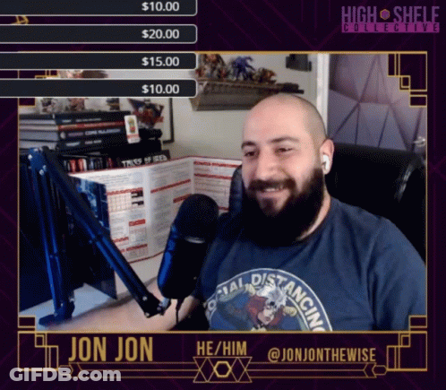 Bearded Man At Microphone Wearing Jon Jon Shirt GIF