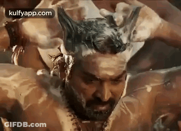 Bearded Man Bathing With Foam On Head GIF