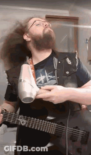Bearded Man Blow Drying Hair Playing Guitar GIF