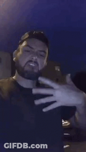 Bearded Man Blowing Smoke GIF