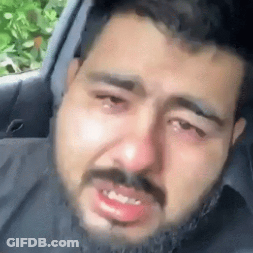 Bearded Man Crying In Back Seat GIF