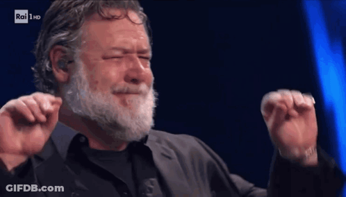 Bearded Man Dancing Before Rai HD Screen GIF