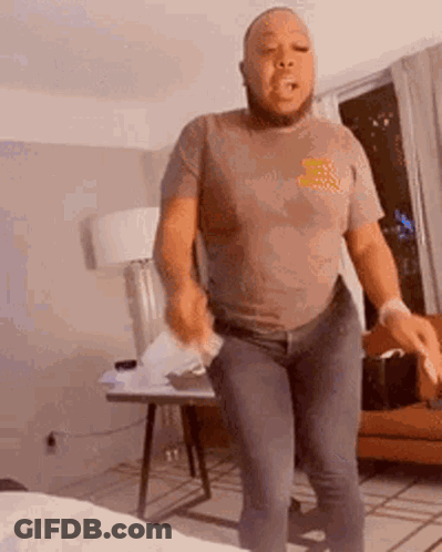 Bearded Man Dancing Holding Paper GIF