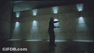Bearded Man Dancing In Dark Room GIF