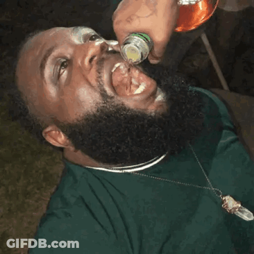 Bearded Man Drinking Bottle With Tongue Out GIF