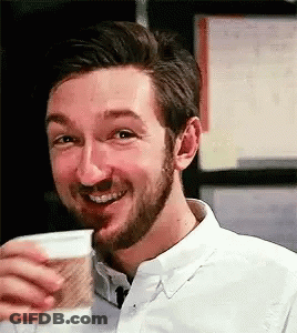 Bearded Man Drinking From Cup Smiling GIF