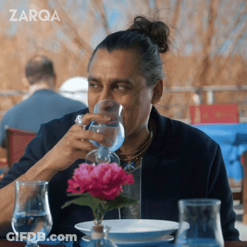 Bearded Man Drinking From Red Mug GIF