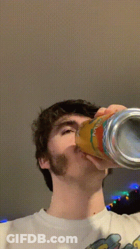 Bearded Man Drinking From Simpson Can GIF