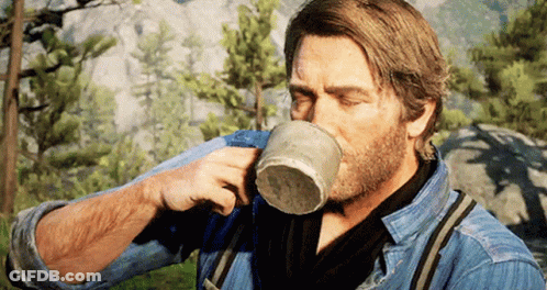 Bearded Man Drinking In Woods GIF