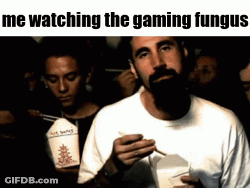 Bearded Man Eating Chinese Food While Watching Video Game GIF