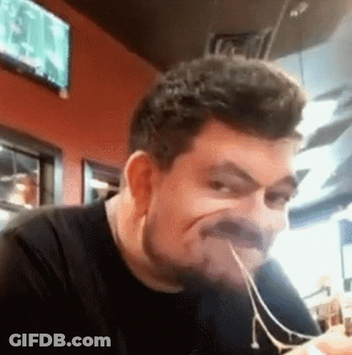 Bearded Man Eating Spaghetti Making Face GIF