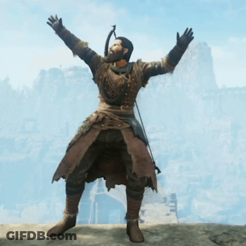 Bearded Man Flexing Muscles In Front Of Mountain GIF