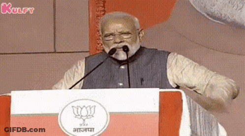 Bearded Man Giving Speech With Microphone In Mouth At Podium GIF