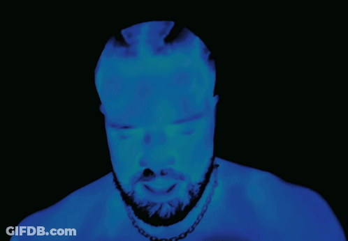 Bearded Man Glowing In Darkness GIF
