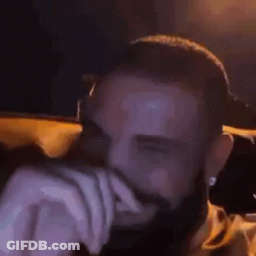Bearded Man Hands On Face Dark Room GIF